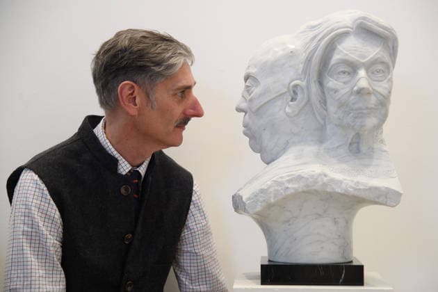 The Society of Portrait Sculptors: FACE 2026 Exhibition at Garrison Chapel, Chelsea Barracks, London, UK - Thursday 9 April 2026 A staff member views A Meeting of Minds by Tim Bates at Garrison Chapel, Chelsea Barracks, London, England, UK on Thursday 9 April, 2026 as part of The Society of Portrait Sculptors: FACE 2026 Exhibition which runs from 13th - 26th April., Credit:Justin Ng Avalon UK, England, London, Garrison Chapel, Chelsea Barracks  Copyright: xJustinxNgx xAvalonx 1089724196