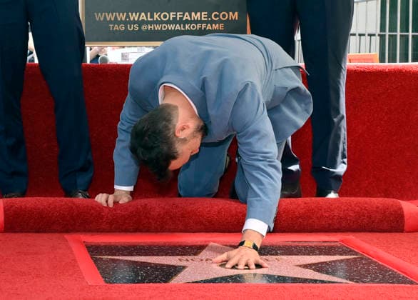 American actor, director and writer Noah Wyle touches his star during an unveiling ceremony honoring him with the 2,840th star on the Hollywood Walk of Fame in Los Angeles on Thursday, April 9, 2026.  LAP20260409907 JIMxRUYMEN