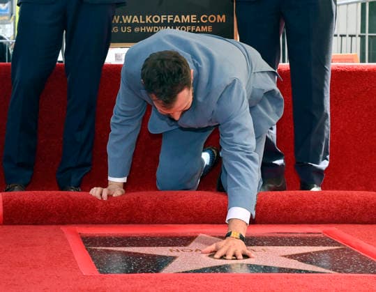 American actor, director and writer Noah Wyle touches his star during an unveiling ceremony honoring him with the 2,840th star on the Hollywood Walk of Fame in Los Angeles on Thursday, April 9, 2026.  LAP20260409908 JIMxRUYMEN