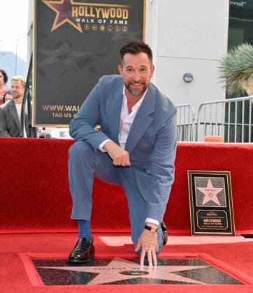 American actor, director and writer Noah Wyle touches his star during an unveiling ceremony honoring him with the 2,840th star on the Hollywood Walk of Fame in Los Angeles on Thursday, April 9, 2026.  LAP20260409911 JIMxRUYMEN