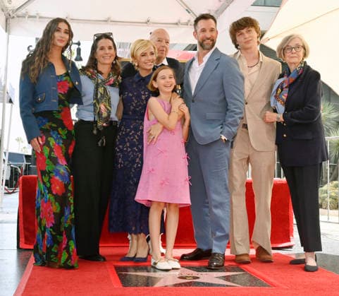 American actor, director and writer Noah Wyle (blue suit) is joined by his parents Stephen Wyle (4-R) and Marjorie Speer (R), his wife actress Sara Wells (3-L) his chidren Auden Wyle (L), Frances Harper Wyle (4R) and Owen Strausser Wyle (2-R) and his sister Alex Wyle (2-L) during an unveiling ceremony honoring him with the 2,840th star on the Hollywood Walk of Fame in Los Angeles on Thursday, April 9, 2026.  LAP20260409912 JIMxRUYMEN