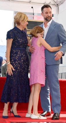 American actor, director and writer Noah Wyle (blue suit) is joined by his wife, actress Sara Wells and daughter Frances Harper Wyle during an unveiling ceremony honoring him with the 2,840th star on the Hollywood Walk of Fame in Los Angeles on Thursday, April 9, 2026.  LAP20260409915 JIMxRUYMEN