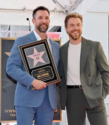 American actor, director and writer Noah Wyle is joined by dancer Derek Hough during an unveiling ceremony honoring him with the 2,840th star on the Hollywood Walk of Fame in Los Angeles on Thursday, April 9, 2026.  LAP20260409916 JIMxRUYMEN