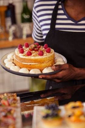 Close up view of appetizing cake Close up view of appetizing cake at coffee shop, model released, , property released, Cape Town, South Africa, 07.02.2016, 753529.jpg, shop, cafe, retail, coffee shop, cafeteria, restaurant, staff, food and drink industry, food, lifestyle, coffee house, cake, appetizing, delicious, pastries, meal, cooking, closeup, strawberries, fruit, plate, presentation, home, presenting 30s, Mid Adult, Man, Male, Black, 30-34 Years, Mid Adult Men, African Ethnicity