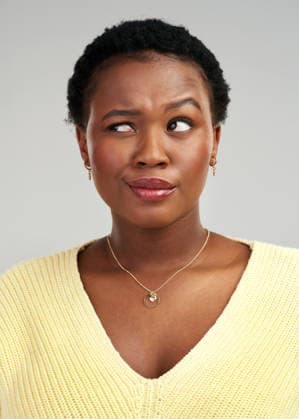 Confused, insight and thinking with black woman in studio for problem solving or solution. Brainstorming, doubt and question with thoughtful African person on white background for contemplation. model released property released Copyright: xwww.peopleimages.comx