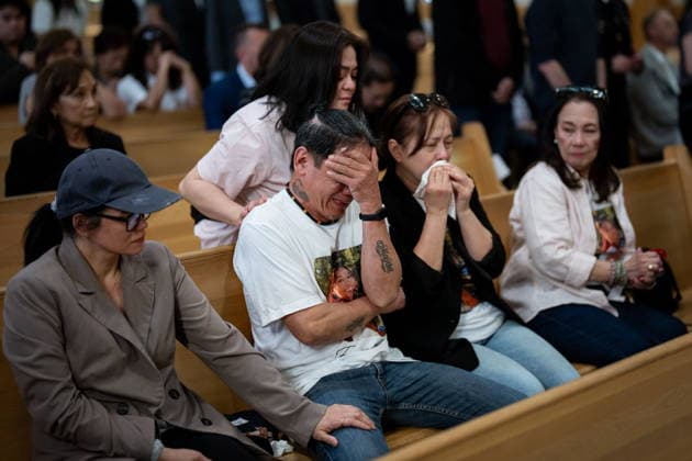 April 10, 2026, Bc, CANADA: Father of victim Jendhel Sico, Rodel Sico, second from left, holds his head during Lapu-Lapu festival tragedy commemoration memorial mass at St. Andrew s Parish in Vancouver, on Friday April 10, 2026. CANADA  - ZUMAc35_ 20260410_zaf_c35_054 Copyright: xEthanxCairnsx