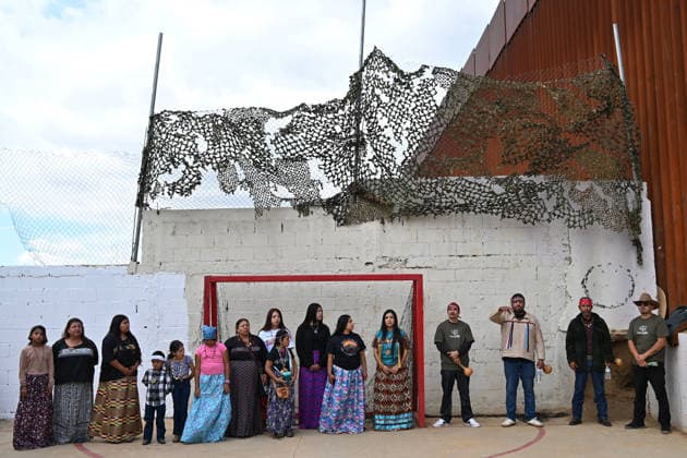 April 12, 2026, Tecate, Baja California, Mexico: Members of native communities, mainly Kumeyaay native group, during a â€oeceremony†rally against the destruction of the Kuchamaa Mountain left by the construction of a new border wall at the US-Mexico Border in Tecate, Baja California, Mexico on Sunday, April 12, 2026. The Kuchamaa Mountain is considered a sacred site by native groups living in both sides of the border. Tecate Mexico - ZUMAm180 20260412_zip_m180_010 Copyright: xCarlosxA.xMorenox