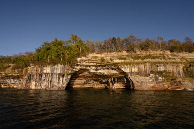 Pictured Rocks National Lakeshore sandstone cliffs and sea caves Munising, Michigan, United States CR_MCKJ260411-1975799-01