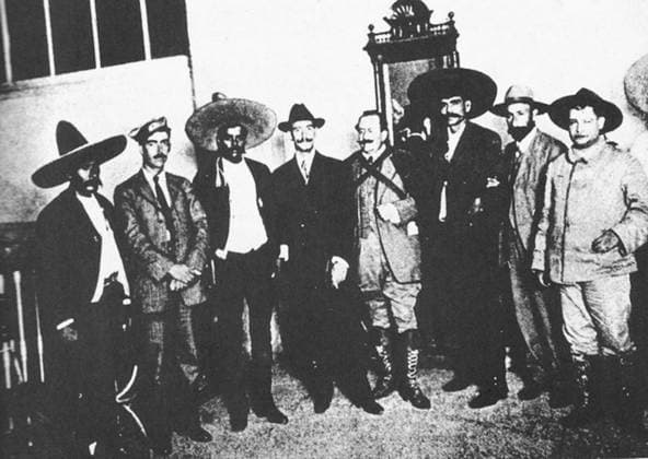 RECORD DATE NOT STATED A photograph of Emiliano Zapata and Pancho Villa in the National Palace. A photograph of Emiliano Zapata (1879-1919), Francisco Villa, and other revolutionary leaders, depicted in the National Palace, Mexico City during the Mexican Revolution (1910-1920). There was a brief alliance between the two peasant leaders. 1914. Editorial use only. All uses to be cleared in advance with World History Archive, or the designated agent of World History Archive., WHA_011_0656.jpg, Emiliano Zapata; Francisco Villa; Mexican Revolution; Mexico; Mexico City; National Palace; 1914; Revolutionary leaders; Peasant leaders; Zapata; Villa; 20th Century; Mexican History; Latin American History; Porfiriato; Social movements; Political histor Copyright: xx