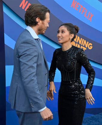 Cast members Scott MacArthur (L) and Brenda Song attend the premiere of Netflix s Season 2 TV series sport comedy Running Point at the Egyptian Theatre in the Hollywood section of Los Angeles on Wednesday, April 15, 2026..Storyline: Isla Gordon, overlooked her whole life, is appointed President of the LA Waves basketball team, a family business, when her brother enters rehab. She aims to prove she is the right choice despite skepticism.  LAP2026041531 JIMxRUYMEN