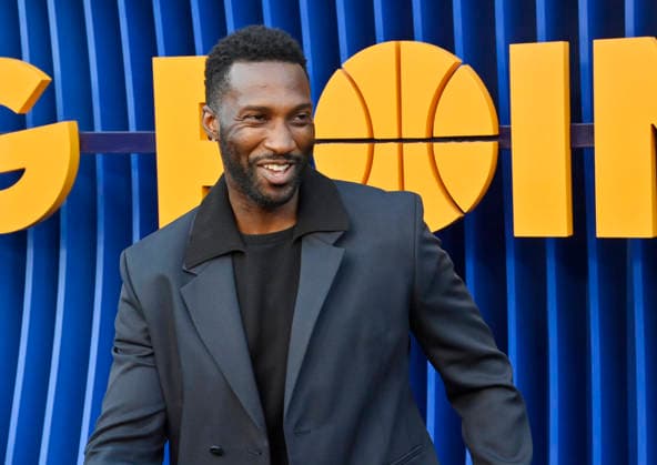 Cast member Justin Hurt-Dunkley attends the premiere of Netflix s Season 2 TV series sport comedy Running Point at the Egyptian Theatre in the Hollywood section of Los Angeles on Wednesday, April 15, 2026..Storyline: Isla Gordon, overlooked her whole life, is appointed President of the LA Waves basketball team, a family business, when her brother enters rehab. She aims to prove she is the right choice despite skepticism.  LAP2026041550 JIMxRUYMEN