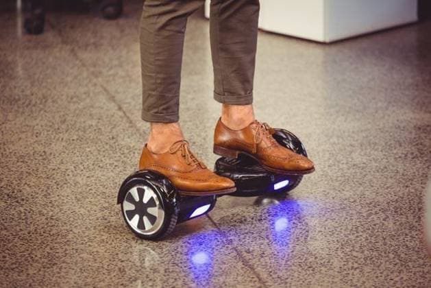 Business executive standing on hoverboard Business executive standing on hoverboard in office, model released, , property released, Cork, Ireland, 19.03.2016, 874600.jpg, office, workplace, executive, standing, floor, marble, balancing, board, hoverboard, self-balancing, illuminated, electric, balance, technology, wheel, modern, futuristic, two-wheeled, graphic designer, artist, profession, professional, occupation, job, electronic, creative, creativity, skill