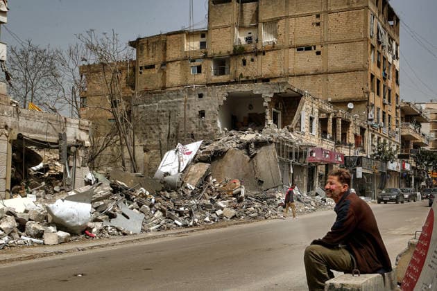 April 18, 2026, Nabatiyeh, Nabatiyeh, Lebanon: A man sits in front of destruction in the southern Lebanese town of Nabatiyeh. Lebanese who began returning to devastated towns and neighborhoods, found their homes destroyed or uninhabitable and hesitant to stay for fear a ceasefire between Hezbollah and Israel could unravel. Nabatiyeh Lebanon - ZUMAn313 20260418_zip_n313_006 Copyright: xMarwanxNaamanix