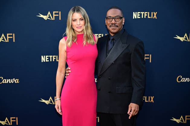 Eddie Murphy and wife Paige Butcher attend the 51st American Film Institute (AFI) Life Achievement Award ceremony at The Dolby Theatre in the Hollywood section of Los Angeles on Saturday, April 18, 2026. Hollywood legends gathered Saturday at the gala tribute to Eddie Murphy in celebration of his five-decade career.  LAP2026041846 JOHNxMCCOY