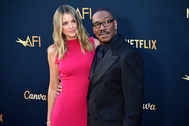 Eddie Murphy and wife Paige Butcher attend the 51st American Film Institute (AFI) Life Achievement Award ceremony at The Dolby Theatre in the Hollywood section of Los Angeles on Saturday, April 18, 2026. Hollywood legends gathered Saturday at the gala tribute to Eddie Murphy in celebration of his five-decade career.  LAP2026041847 JOHNxMCCOY
