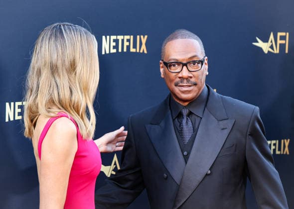 April 18, 2026, Hollywood, California, USA: American Actor and Comedian EDDIE MURPHY, 65, and his Australian Actress wife PAIGE BUTCHER, 46, in a Barbie-pink dress, is on the Red Carpet before Murphy receives the American Film Instituteâ€⠢s (AFI) Life Time Achievement Award on April 18, 2026 in Hollywood, California at the Dolby Theater, Los Angeles. The event is sponsored by Netflix. Hollywood USA - ZUMAk144 20260418_znp_k144_003 Copyright: xAmyxKatzx