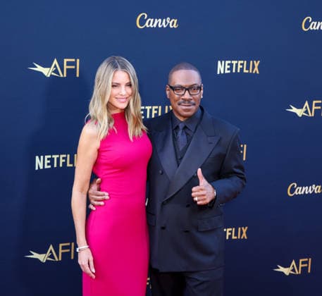 April 18, 2026, Hollywood, California, USA: American Actor and Comedian EDDIE MURPHY, 65, and his Australian Actress wife PAIGE BUTCHER, 46, in a Barbie-pink dress, is on the Red Carpet before Murphy receives the American Film Instituteâ€⠢s (AFI) Life Time Achievement Award on April 18, 2026 in Hollywood, California at the Dolby Theater, Los Angeles. The event is sponsored by Netflix. Hollywood USA - ZUMAk144 20260418_znp_k144_012 Copyright: xAmyxKatzx