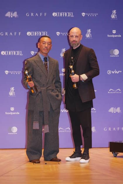 HONG KONG, CHINA - APRIL 19: Japanese musician and composer Ryuichi Sakamoto, UK based musician, film-composer Nate Connelly pose with trophies at backstage during the 44th Hong Kong Film Awards on April 19, 2026 in Hong Kong, China.  Copyright: xVCGx 111635891444