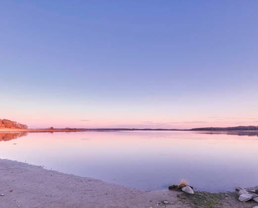 Beautiful landscape banner view of the ocean on the coast against a pink sunset in the sky in summer. Relaxing copyspace view of the calm sea water and beach at the seashore along the coastline. (License=RF) ,model released, Symbolfoto  Copyright: xZoonar.com KasperxRavlox 18892899 ,model released, Symbolfoto ,property released
