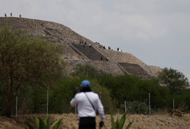 (260421) -- STATE OF MEXICO, April 21, 2026 -- Rescuers work at the site of a shooting at the Teotihuacan archaeological site in the State of Mexico, Mexico, April 20, 2026. A shooting at the Teotihuacan archaeological site in central Mexico has left two people dead, including the attacker, and six others injured, authorities said Monday. (Str Xinhua) MEXICO-STATE OF MEXICO-TEOTIHUACAN ARCHAEOLOGICAL SITE-SHOOTING Stringer 