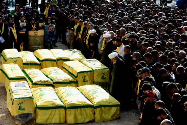 (260421) -- KFAR SIR, April 21, 2026 -- People attend a funeral of Hezbollah members killed during the Israeli strikes, in Kfar Sir, southern Lebanon, April 21, 2026. (Photo by Xinhua) LEBANON-KFAR SIR-HEZBOLLAH-FUNERAL AlixHashisho 
