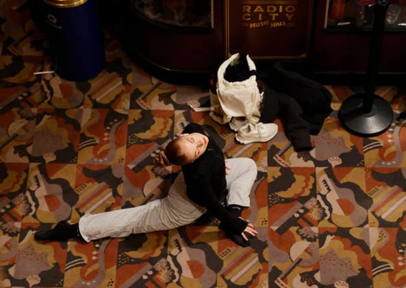 Dancers warm up in the Grand Foyer at Radio City Music Hall before auditioning at the Rockettes open call auditions at Radio City Music Hall in New York City on Wednesday, April 22, 2026. Dancers attending the audition will be considered for a spot on the Rockettes line in the 2026 Christmas Spectacular Starring the Radio City Rockettes and for an invitation to participate in the company s no-fee dancer development.programming this summer which serves as the Rockettes main talent pipeline.  NYP20260422105 JohnxAngelillo