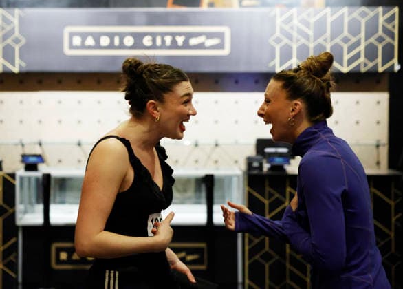Dancers greet each other when they warm up in the Grand Foyer at Radio City Music Hall before auditioning at the Rockettes open call auditions at Radio City Music Hall in New York City on Wednesday, April 22, 2026. Dancers attending the audition will be considered for a spot on the Rockettes line in the 2026 Christmas Spectacular Starring the Radio City Rockettes and for an invitation to participate in the company s no-fee dancer development.programming this summer which serves as the Rockettes main talent pipeline.  NYP20260422132 JohnxAngelillo