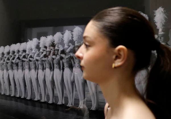A dancer walks past a photo of past Rockets on stage at the Rockettes open call auditions at Radio City Music Hall in New York City on Wednesday, April 22, 2026. Dancers attending the audition will be considered for a spot on the Rockettes line in the 2026 Christmas Spectacular Starring the Radio City Rockettes and for an invitation to participate in the company s no-fee dancer development.programming this summer which serves as the Rockettes main talent pipeline.  NYP20260422142 JohnxAngelillo