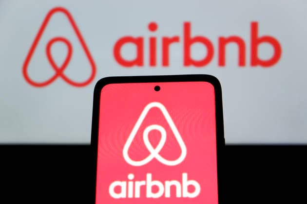April 23, 2026, Bandung, West Java, Indonesia: In this photo illustration, Airbnb logo is displayed on a smartphone with Airbnb logo in the background Bandung Indonesia - ZUMAs281 20260423_zip_s281_006 Copyright: xAlgixFebrixSugitax