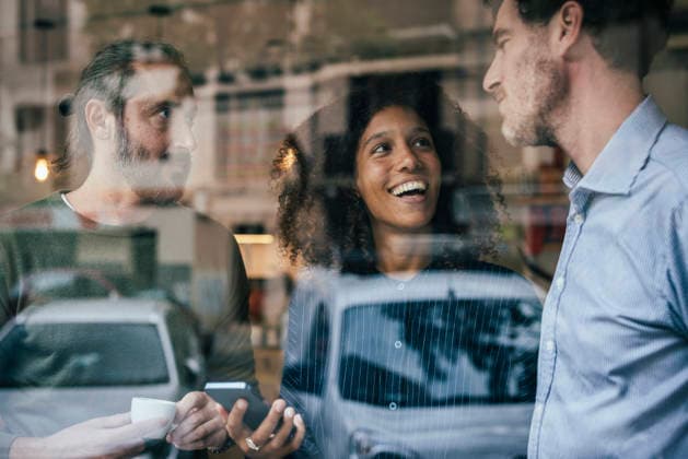 Business coworkers using smartphone in cafe model released, Symbolfoto property released, JOSEF24385