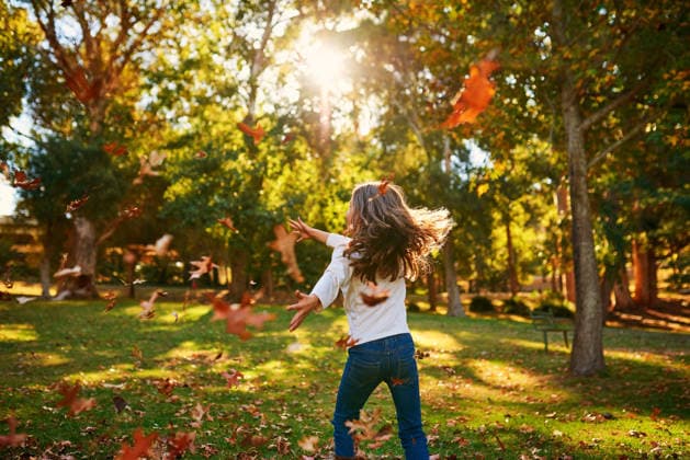 Nothing says fun like playing amongst the autumn leaves. a happy little girl playing in the autumn leaves outdoors (License=RF) ,model released, Symbolfoto  Copyright: xZoonar.com YURIxARCURxPRODUCTIONSxx MSxYAPRx 18999289 ,model released, Symbolfoto ,property released