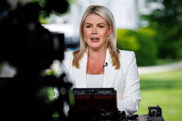 White House Press Secretary Karoline Leavitt gives a television interview in front of the West Wing at the White House in Washington, DC on Friday, April 24, 2026.  WASP20260424102 SamuelxCorum