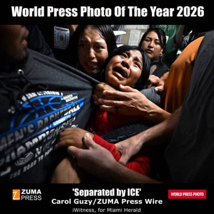 THE WORLD PRESS AWARDS 2026 PHOTO OF THE YEAR: is Separated by ICE by , ZUMA Press, iWitness for Miami Herald. Taken inside the only U.S. federal building where photographers were granted access, hallways on 12th where ZUMA s and others showed up, day after day, to document what was happening. It captures a harrowing moment: a family separated by the state. Luis was detained by Immigration and Customs Enforcement (I.C.E.) agents following an immigration court hearing at the Jacob K. Javits Federal Building, downtown New York City on August 26, 2025. This award highlights the critical importance of the story worldwide, Guzy said. We bear witness to the suffering of countless families, but also to their grace and resilience that trans - ZUMAz03_ 20260424_zbt_z03_551 Copyright: xCarolxGuzyx