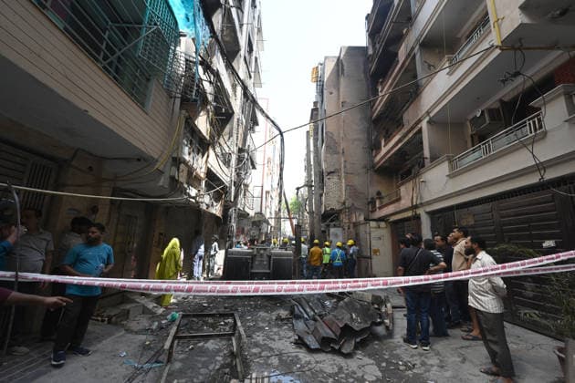 NEW DELHI, INDIA - APRIL 25: A major fire broke out in an electric transformer spread to multiple residential buildings in east Delhi s Ramesh Park, Laxmi Nagar area in the early hours of Saturday, on April 25, 2026 in New Delhi, India. According to the fire department, the fire started in an electric transformer and gradually spread to three nearby buildings. A total of 14 flats were affected by the blaze. Most residents were inside their homes at the time of the incident, causing widespread panic. Seven fire engines brought the fire under control. (Photo by Sonu Mehta Hindustan Times ) Massive Fire Breaks Out In Transformer in Delhi™s Laxmi Nagar Area , Spreads To Three Buildings