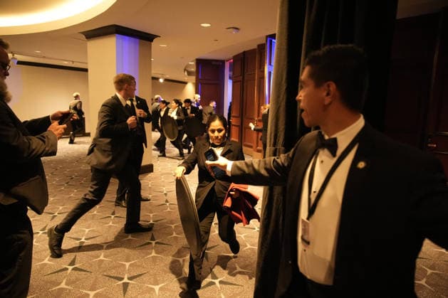Employees, Secret Service and members of staff flee in the Washington Hilton after shots were heard during the White House Correspondents Dinner in Washington, DC, on April 25, 2026. Shots were fired as President Donald Trump attended a press dinner for the first time as President.  WASP20260425121 YurixGripas