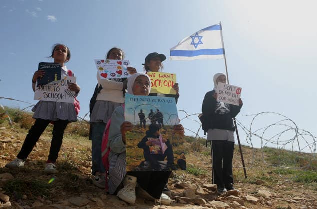 Palestinian students continue their sit-in and study on the side of a road, which has been closed by settlers and Israeli forces, preventing them from reaching their schools, in the village of Umm al-Khair in Masafer Yatta, Palestinian students continue their sit-in and study on the side of a road, which has been closed by settlers and Israeli forces, preventing them from reaching their schools, in the village of Umm al-Khair in Masafer Yatta, near Hebron in the southern West Bank. April 26, 2026 Israeli settlers had closed the shortcut used by students and Palestinian villagers, which passes through the new Jewish settlement outpost of Carmel, following the Gaza war that began in 2023. Photo by Mamoun Wazwaz apaimages Hebron West Bank Pa Copyright: xapaimagesxMamounxWazwazx xapaimagesx