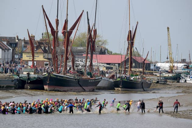 Maldon Mud Race Hundreds of competitors take part in the annual Maldon Mud race. The race is run on a 450 metre course across the River Blackmore from a spot in the towns Promenade Park and can only take place at low tide. This event originated in the 70™s when a local man was challenged to don a tuxedo to serve a meal on the bank of the river. This later led to a race across the river where locals had to drink a pint from a waiting barrel of beer before racing back again. Now competitors dress in wacky costumes to take part in the annual spectacle. Essex Promenade Park Maldon UK Copyright: xMartinxDaltonx Maldon_MudRace_260426_MD_069