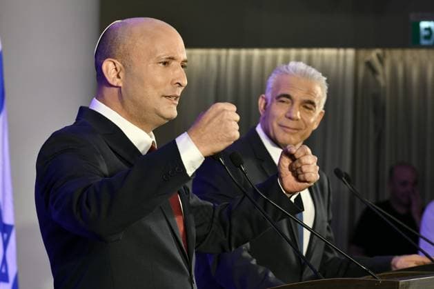 (260427) -- HERZLIYA, April 27, 2026 -- Israeli opposition leader Yair Lapid (R) and former Prime Minister Naftali Bennett attend a press conference in Herzliya, Israel, April 26, 2026. Israeli opposition leader Yair Lapid and former Prime Minister Naftali Bennett said on Sunday that they will run together in this year s elections, aiming to unseat incumbent Prime Minister Benjamin Netanyahu. (JINI via Xinhua) ISRAEL-HERZLIYA-FORMER PMS-ELECTIONS-PRESS CONFERENCE JixNitupianshe 