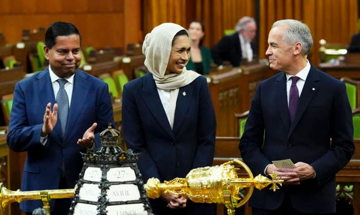 April 27, 2026, Ottawa, On, CAN: Prime Minister Mark Carney, right, and Minister of Public Safety Gary Anandasangaree, left, introduce new member of Parliament Doly Begumon to the House of Commons on Parliament Hill in Ottawa on Monday, April 27, 2026. Ottawa CAN  - ZUMAc35_ 20260427_zaf_c35_035 Copyright: xSeanxKilpatrickx
