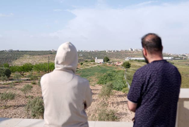 Palestinians evacuate home after Israeli Settler attack in West Bank WEST BANK, PALESTINE - APRIL 27: Israeli forces prevent local residents from approaching a house that had been set on fire Israeli settlers in the village of Jalud, south of Nablus, in West Bank, Palestine on April 27, 2026. According to local sources, dozens of settlers, under the protection of Israeli soldiers, stormed the village and attacked residents and their property with stones and Molotov cocktails, setting fires to homes and vehicles. Issam Rimawi Anadolu Nablus West Bank. Editorial use only. Please get in touch for any other usage.  Copyright: x2026xAnadoluxIssamxRimawix