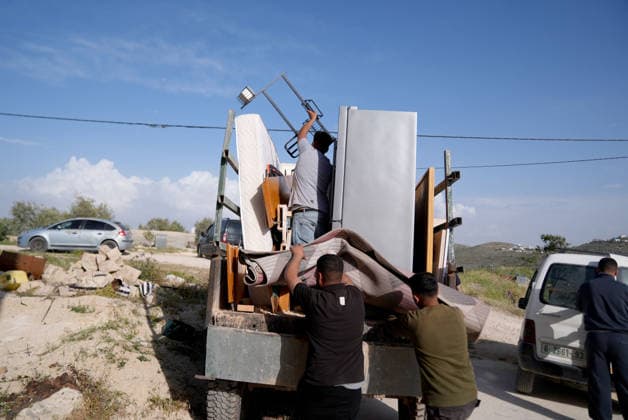 Palestinians evacuate home after Israeli Settler attack in West Bank WEST BANK, PALESTINE - APRIL 27: Palestinians evacuate usable items from a home following an attack by Israeli settlers in the village of Jalud, south of Nablus, in West Bank, Palestine on April 27, 2026. According to local sources, dozens of settlers, under the protection of Israeli soldiers, stormed the village and attacked residents and their property with stones and Molotov cocktails, setting fires to homes and vehicles. Issam Rimawi Anadolu Nablus West Bank. Editorial use only. Please get in touch for any other usage.  Copyright: x2026xAnadoluxIssamxRimawix