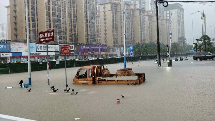 QINZHOU, CHINA - APRIL 27: A truck lies partly submerged in flood water on April 27, 2026 in Qinzhou, Guangxi Zhuang Autonomous Region of China. The torrential rain, which lashed the city Qinzhou from midnight to 8 am on April 27, prompted officials to activate a Level III flood control emergency response.  Copyright: xVCGx 111637618912