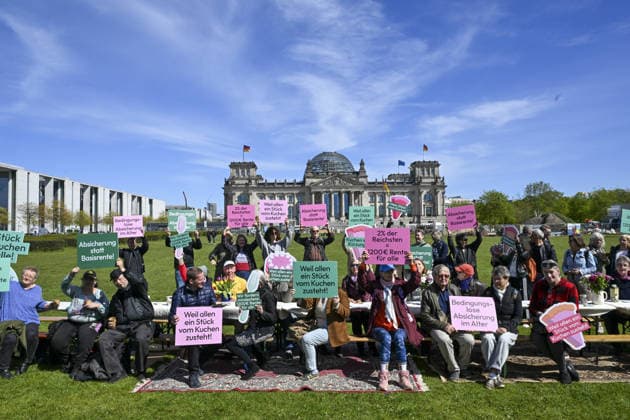 Retirees gather at Bundestag to highlight old-age poverty in Germany BERLIN, GERMANY - APRIL 28: Demonstrators gather in front of the Federal Parliament building (Bundestag) to demand a monthly unconditional basic income of at least 1,200 euros for retirees in Berlin, Germany, on April 28, 2026. Organized under the theme Germany s largest coffee meeting, the protest aimed to draw attention to poverty in old age and called for guaranteed financial security for all pensioners. Halil Sagirkaya Anadolu Berlin Germany. Editorial use only. Please get in touch for any other usage.  Copyright: x2026xAnadoluxHalilxSagirkayax
