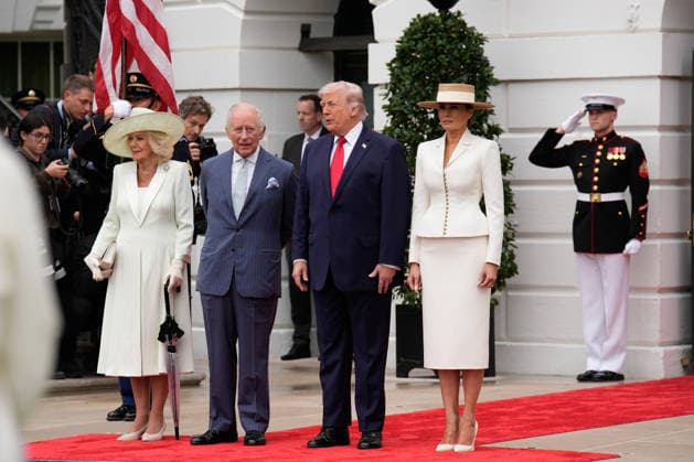 Britain s King Charles III and Queen Camilla are greeted by President Donald Trump and First Lady Melania Trump at an official welcoming ceremony at the White House in Washington DC on Tuesday, April 28, 2026. The king is on a four-day state visit to the U.S. and will stop in New York and Washington, where he will meet with U.S. officials and deliver an address to Congress.  WAX20260428815 YURIxGRIPAS