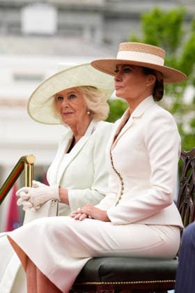 Queen Camila and First lady Melania Trump sit on the podium during an official welcoming ceremony for Britain s King Charles III at the White House in Washington DC on Tuesday, April 28, 2026. The king is on a four-day state visit to the U.S. and will stop in New York and Washington, where he will meet with U.S. officials and deliver an address to Congress.  WAX20260428846 YURIxGRIPAS