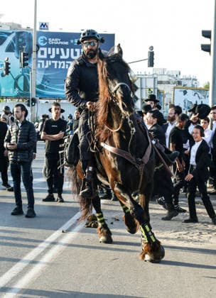 Ultra-Orthodox Jews rally against military conscription in Tel Aviv TEL AVIV, ISRAEL - APRIL 28: Ultra-Orthodox Jews (Haredi) protest against the failure to pass a legal arrangement exempting yeshiva students from mandatory military service and the issuance of draft notices to members of their community in Tel Aviv, Israel on April 28, 2026. Demonstrators lay on a main road in the Bnei Brak area of Tel Aviv, blocking traffic, while Israeli police deployed additional forces and intervened at the scene. Protesters carried banners opposing compulsory military service. Gideon Markowicz Anadolu Tel Aviv Israel. Editorial use only. Please get in touch for any other usage.  Copyright: x2026xAnadoluxGideonxMarkowiczx