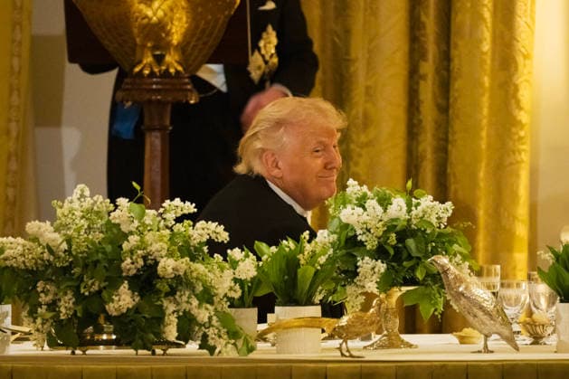 President Donald Trump smiles as Great Britain s King Charles gives remarks during a state dinner with President Donald Trump and First Lady Melania Trump at the White House on Tuesday, April 28, 2026 in Washington, D.C. Charles spoke to a joint session of Congress earlier in the day, and attended several events with U.S. President Donald Trump.  WAX20260428231 CraigxHudson