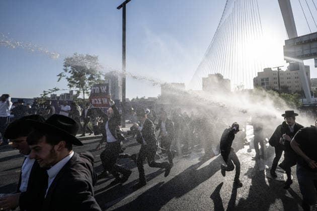 Hundreds of Haredi protesters opposed to mandatory military service in Israel block road leading into West Jerusalem JERUSALEM - APRIL 29: Hundreds of Ultra-Orthodox (Haredi) Jews block the main entrance road and a central bridge leading to West Jerusalem on April 29, 2026, to protest the detention of community members accused of draft evasion. The demonstrators, opposing mandatory military service for religious students, brought traffic to a standstill for several hours before Israeli police intervened to disperse the crowd. Mostafa Alkharouf Anadolu Jerusalem Israel. Editorial use only. Please get in touch for any other usage.  Copyright: x2026xAnadoluxMostafaxAlkharoufx