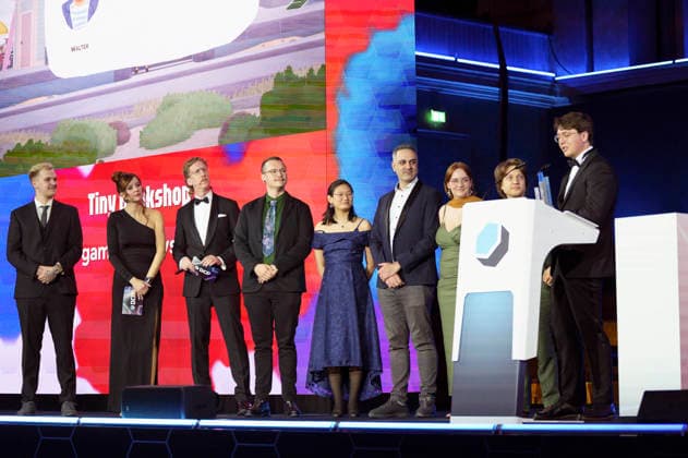 Tobias Huebi Hübenthal, Katrin Bauerfeind und Uke Bosse mit den Gewinnern in der Kategorie Nachwuchspreis Bestes DebuÌˆt bei der Verleihung des Deutschen Computerspielpreises 2026 im Herkulessaal der Residenz. München, 29.04.2026