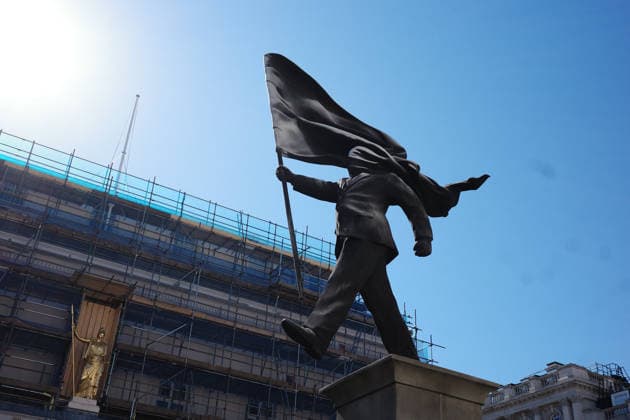 Daiy Life in London Street artist Banksy erected a sculpture - which bears his signature - depicts a suited man walking forward off a plinth while carrying a flag that covers his face at Waterloo Place, on April 30, 2026 in London, United Kingdom. (Photo by Galileo Cheng Nexpher Images) London